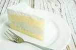 Get this old fashioned lemon snowflake cake recipe and bake the perfect dessert cake for your Christmas get-together. Everyone loves a delicious layer cake.