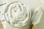 Learn how to make perfect whipped for icing cakes with Grandma's Stabilized Whipped Cream Recipe. It's easy-to-make, reliable, and delicious every time!