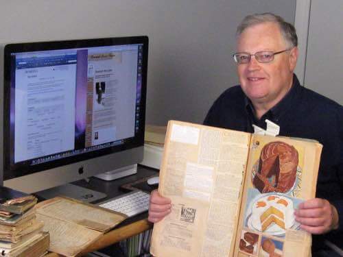 Don Bell With His Mother's Vintage Recipe Scrapbooks