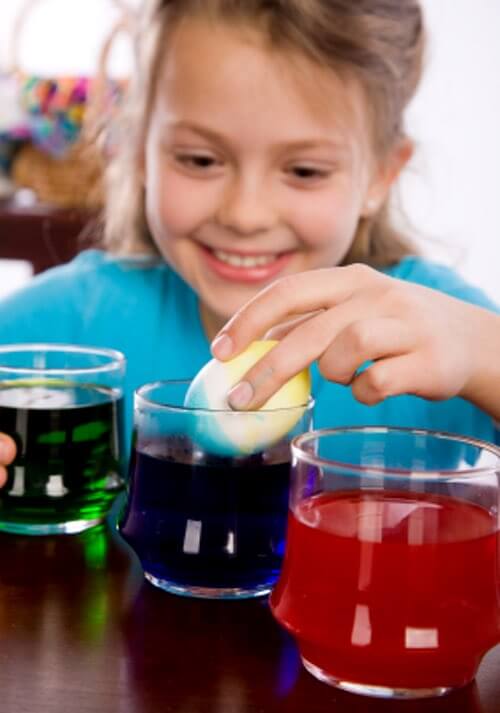 Girl Coloring Easter Eggs
