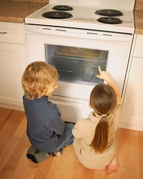 Kids Watching Cookies Baking