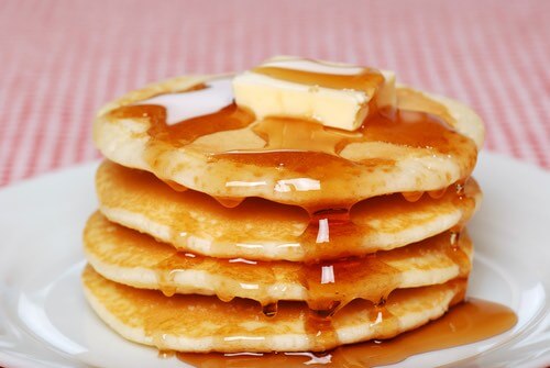 Stack of Old Fashioned Pancakes With Syrup Dripping Down the Sides