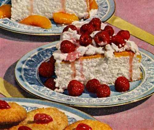 Homemade Angel Cake Topped with Fresh Raspberries and Whipped Cream