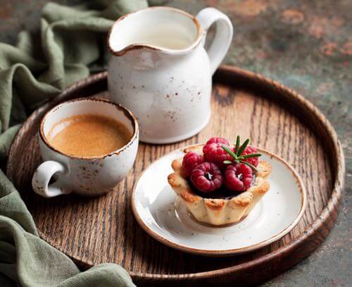 Raspberry Tartlet with a Cup of Tea Served on a Tray