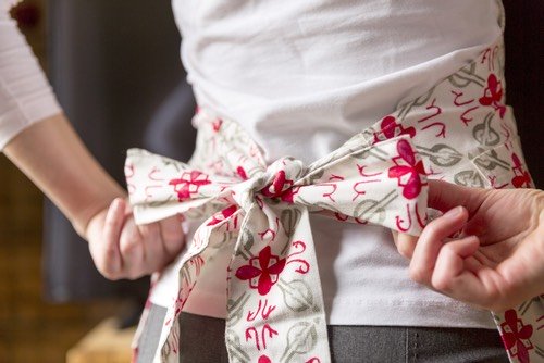 Learn how to sew an apron with free instructions and a vintage pattern download. Lack the time? Get beautiful handmade aprons from Cindy Best's Studio.
